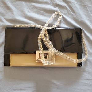 Black and tan clutch with chain